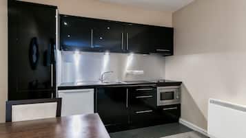 Apartment, 1 Bedroom | Private kitchen | Fridge, microwave, stovetop, coffee/tea maker