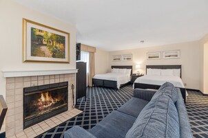 Luxury Studio Suite, Multiple Beds | Living area | 32-inch flat-screen TV with cable channels, TV, iPod dock