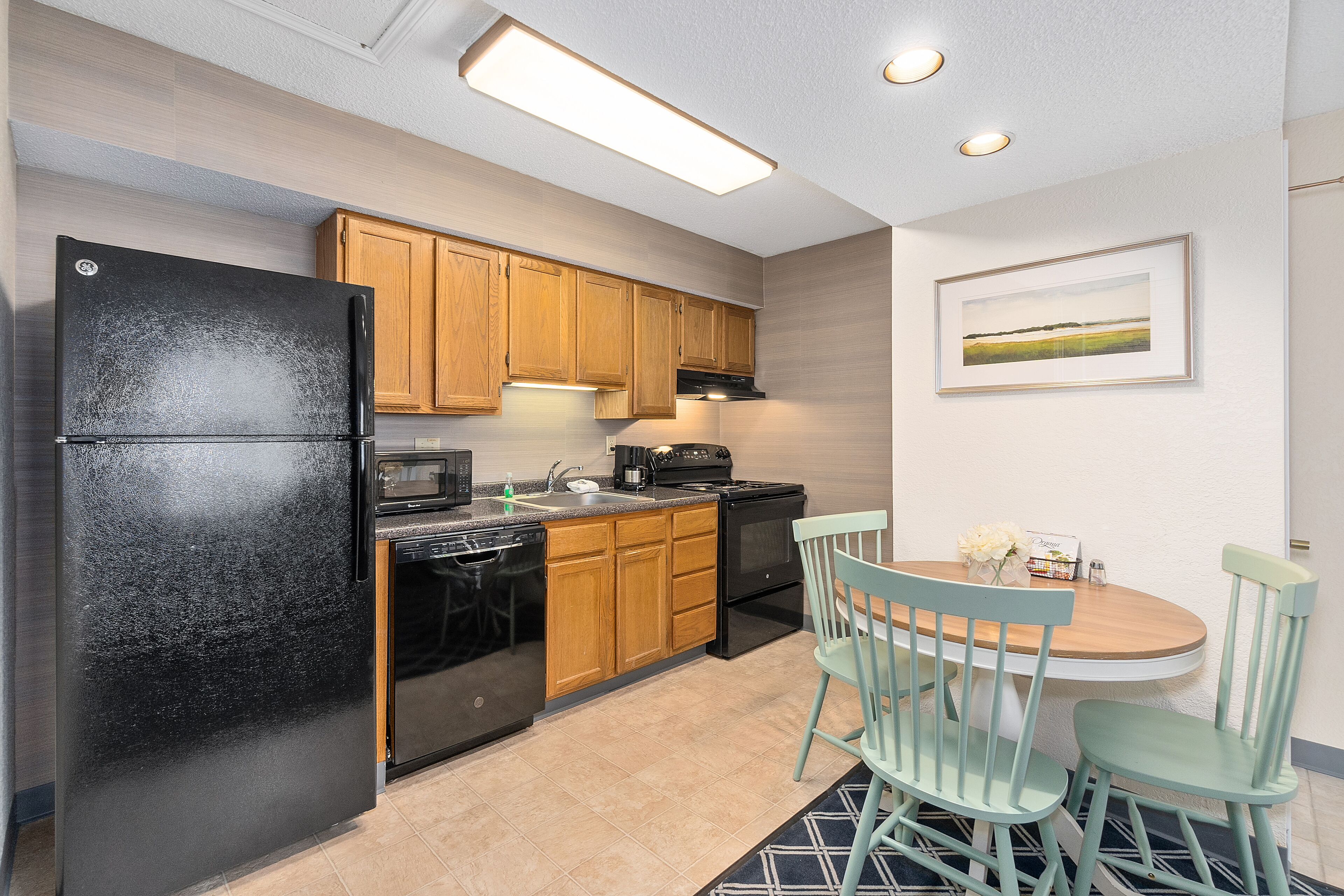 luxury studio suite, 1 king bed | private kitchen | full-sized fridge, microwave, oven, stovetop