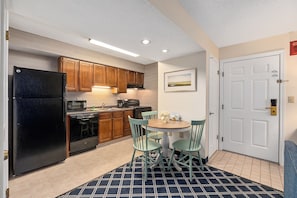 Luxury Studio Suite, Multiple Beds | Private kitchen | Full-size fridge, microwave, oven, stovetop