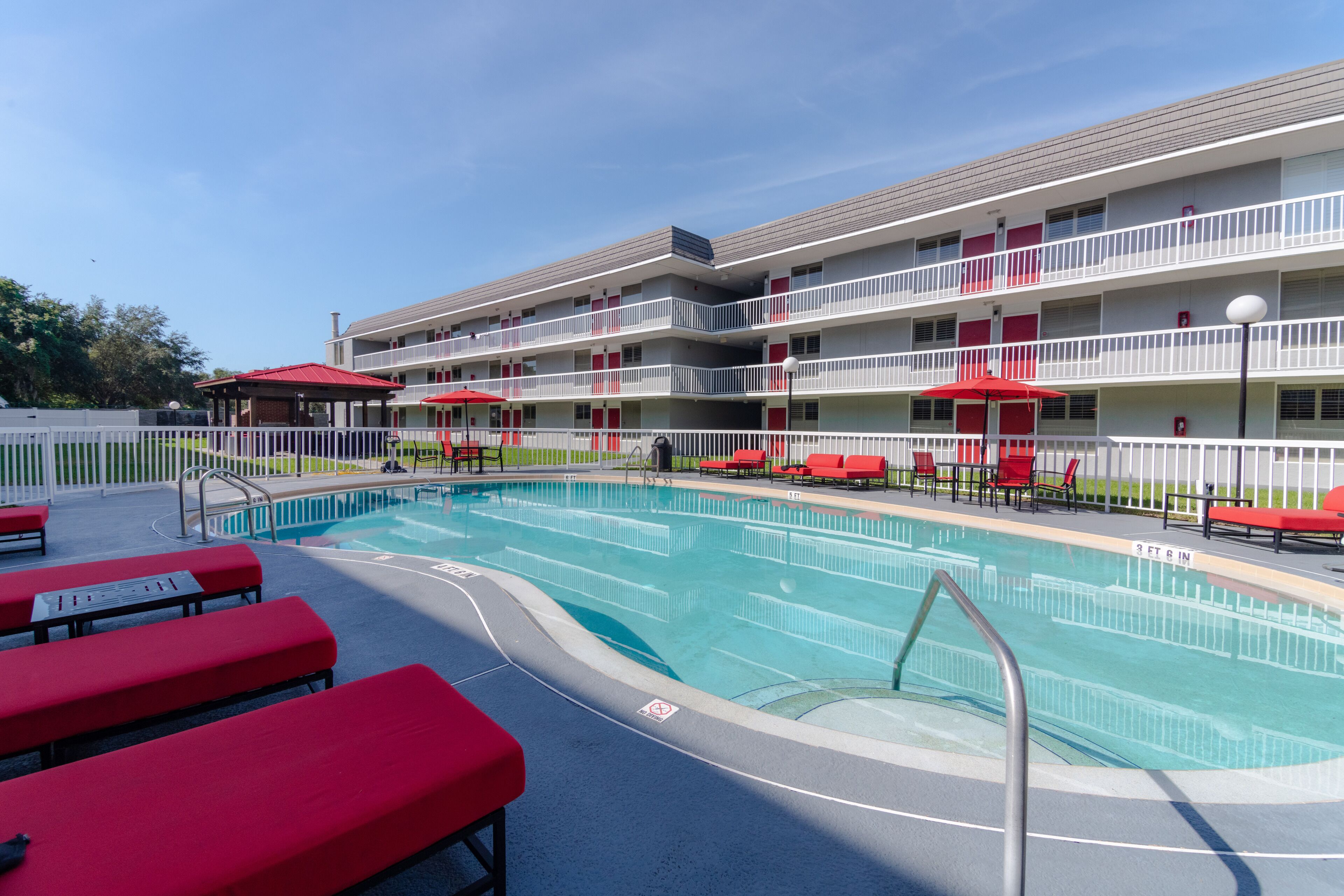 outdoor pool, open 8:00 am to 10:00 pm, pool umbrellas, pool loungers