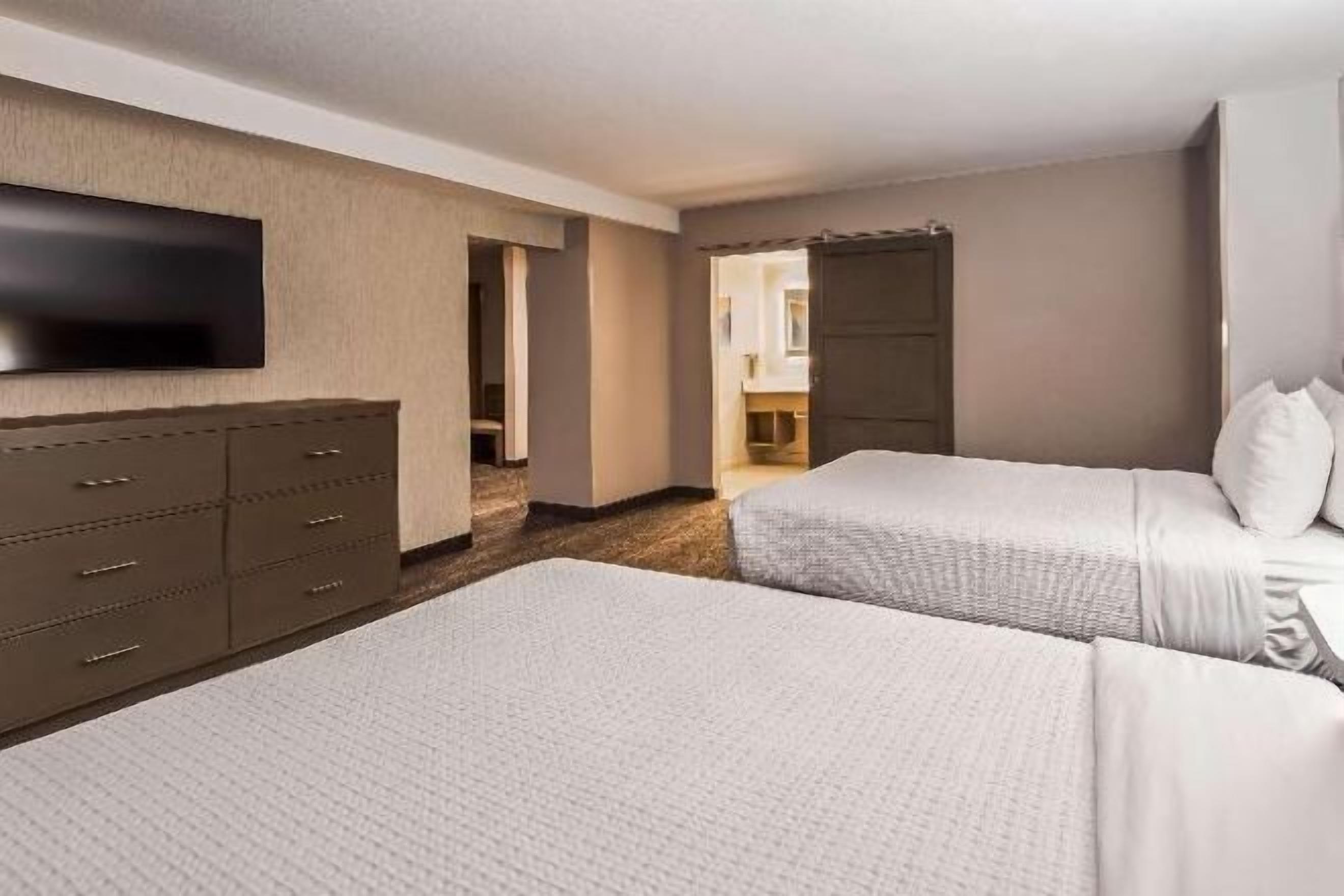 Premium bedding, pillowtop beds, desk, laptop workspace