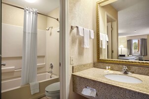 Combined shower/tub, hair dryer, towels, soap