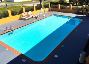 Seasonal outdoor pool, pool umbrellas, pool loungers