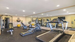 A gym with treadmills, elliptical machines, and free weights. - Best Western Roseville Inn (Roseville)