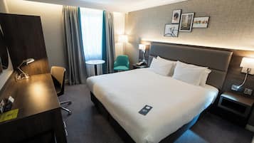 Hypo-allergenic bedding, desk, laptop workspace, blackout drapes