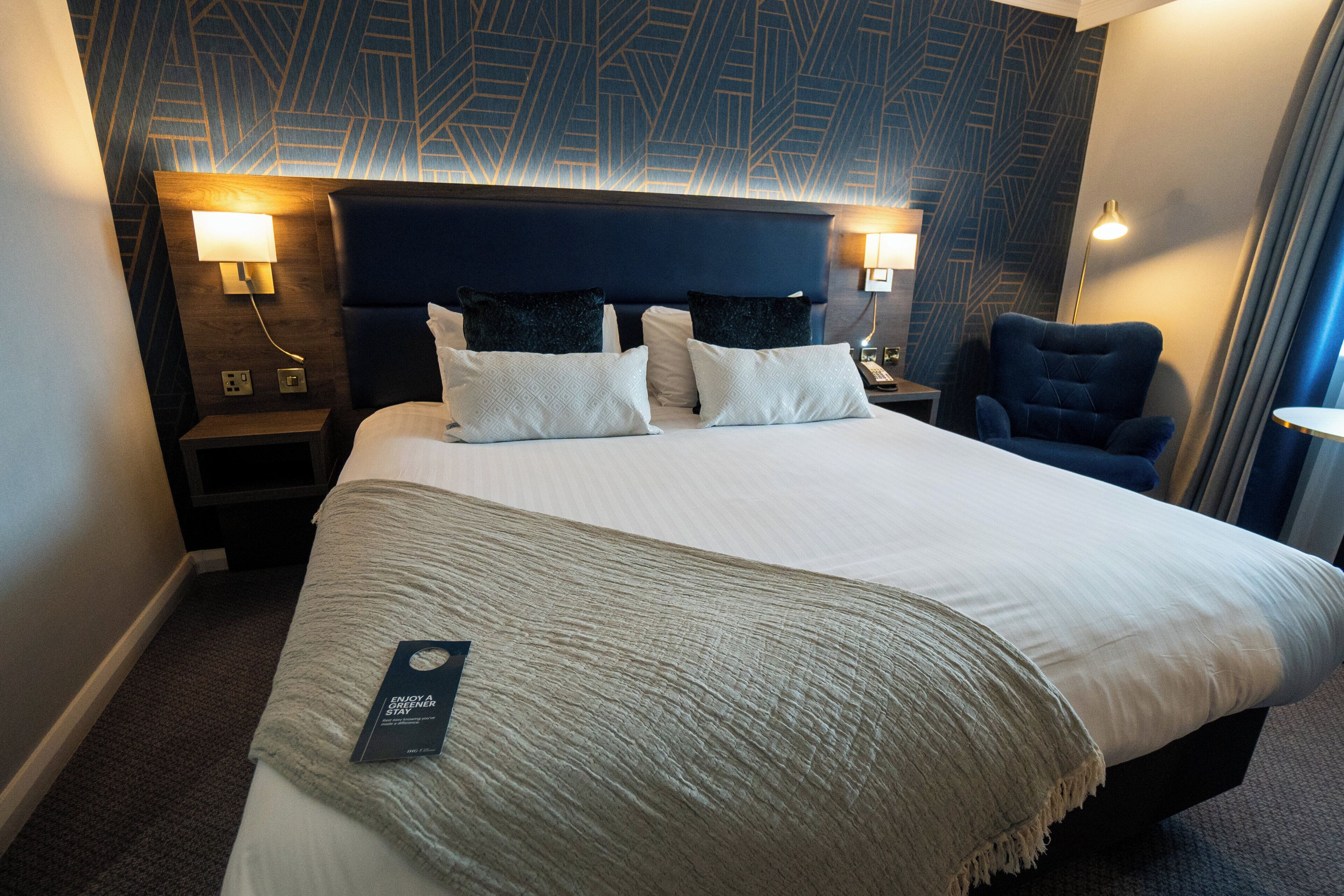 Hypo-allergenic bedding, desk, laptop workspace, blackout curtains