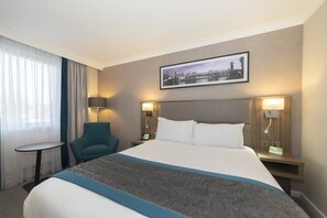 Hypo-allergenic bedding, desk, laptop workspace, blackout curtains