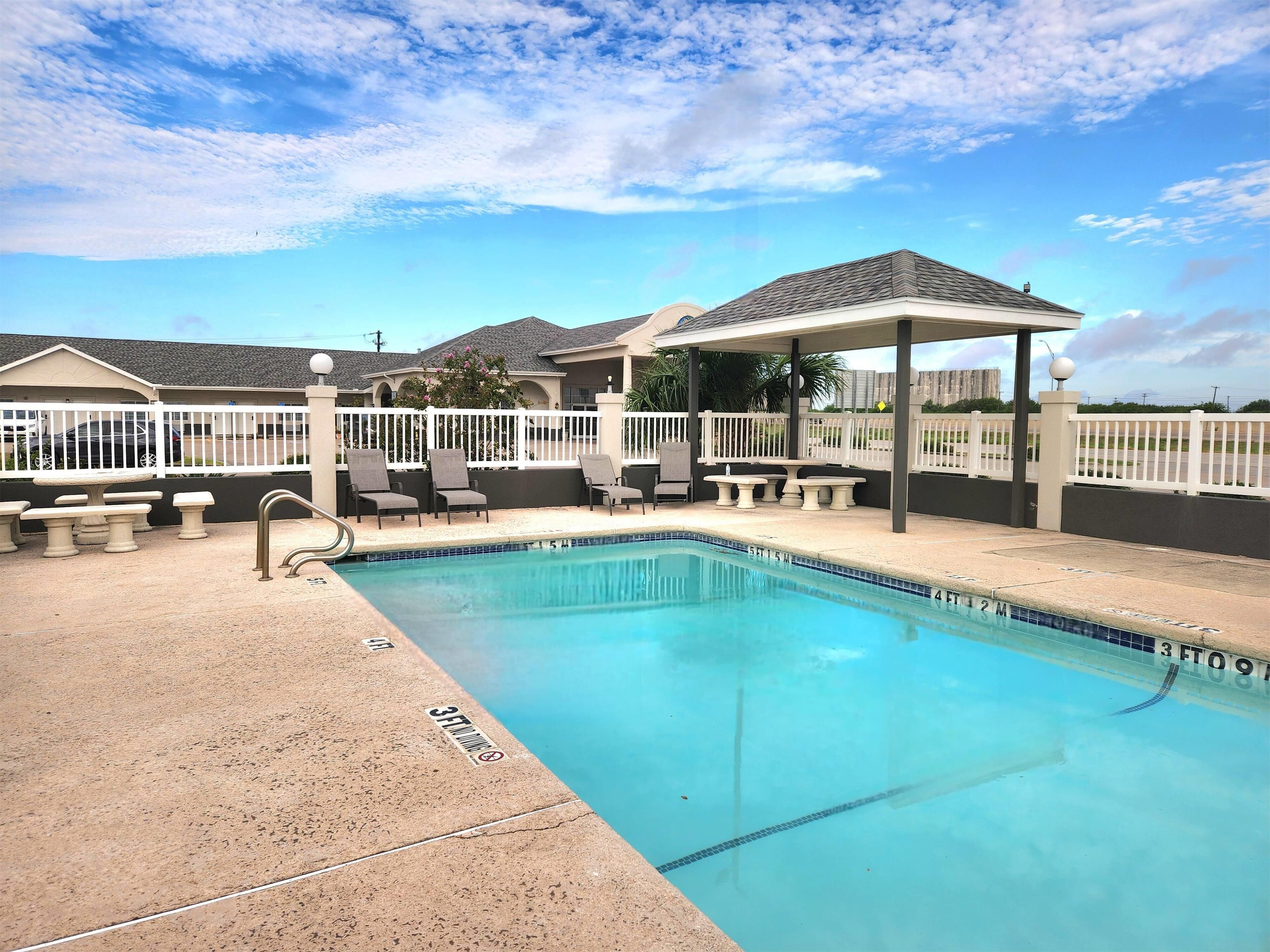 Outdoor pool, open 8 AM to 10 PM, pool umbrellas, pool loungers