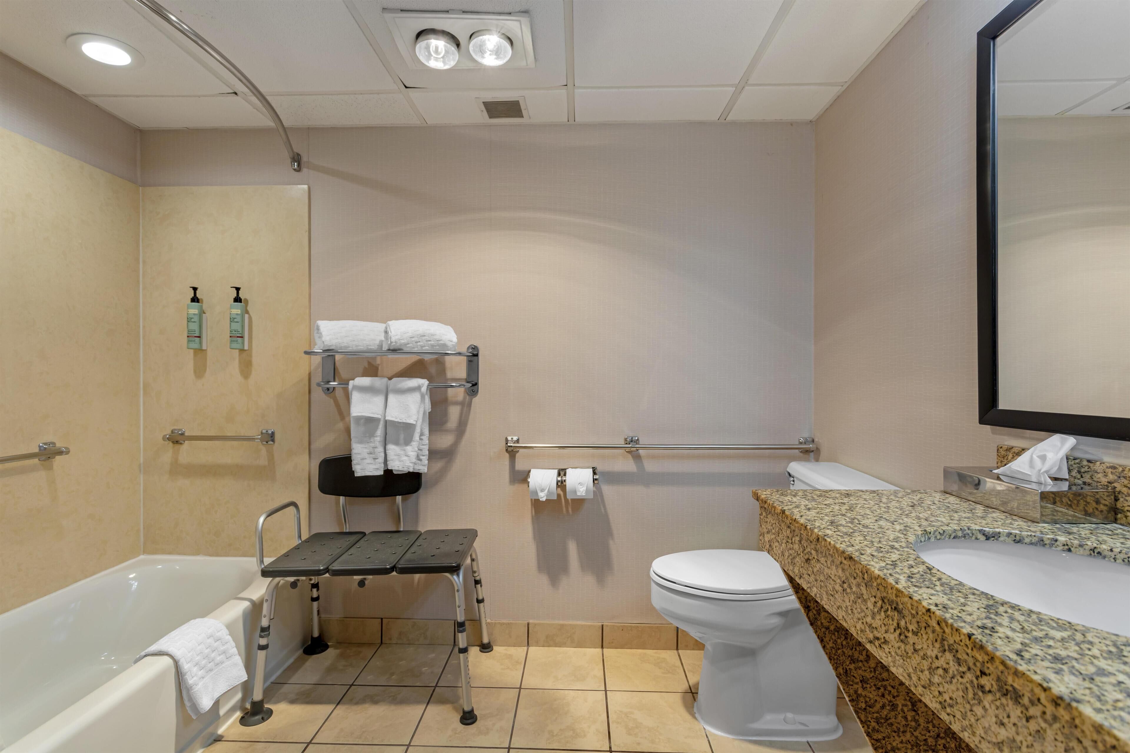 A bathroom with a bathtub, a toilet, a sink, and a shower.