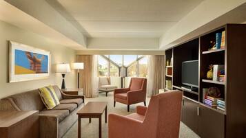 Suite, 1 King Bed, Non Smoking | Living area | 42-inch flat-screen TV with cable channels, TV, pay movies