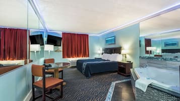 Quarto, 1 cama King, para fumantes, banheira de hidromassagem | Escrivaninha, Wi-Fi de cortesia, roupa de cama
