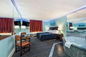 Quarto, 1 cama King, para fumantes, banheira de hidromassagem | Escrivaninha, Wi-Fi de cortesia, roupa de cama
