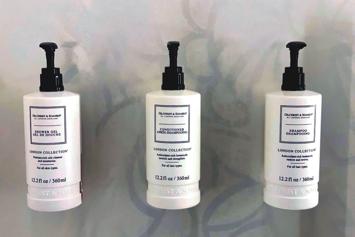 combined shower/bathtub, designer toiletries, hair dryer, towels