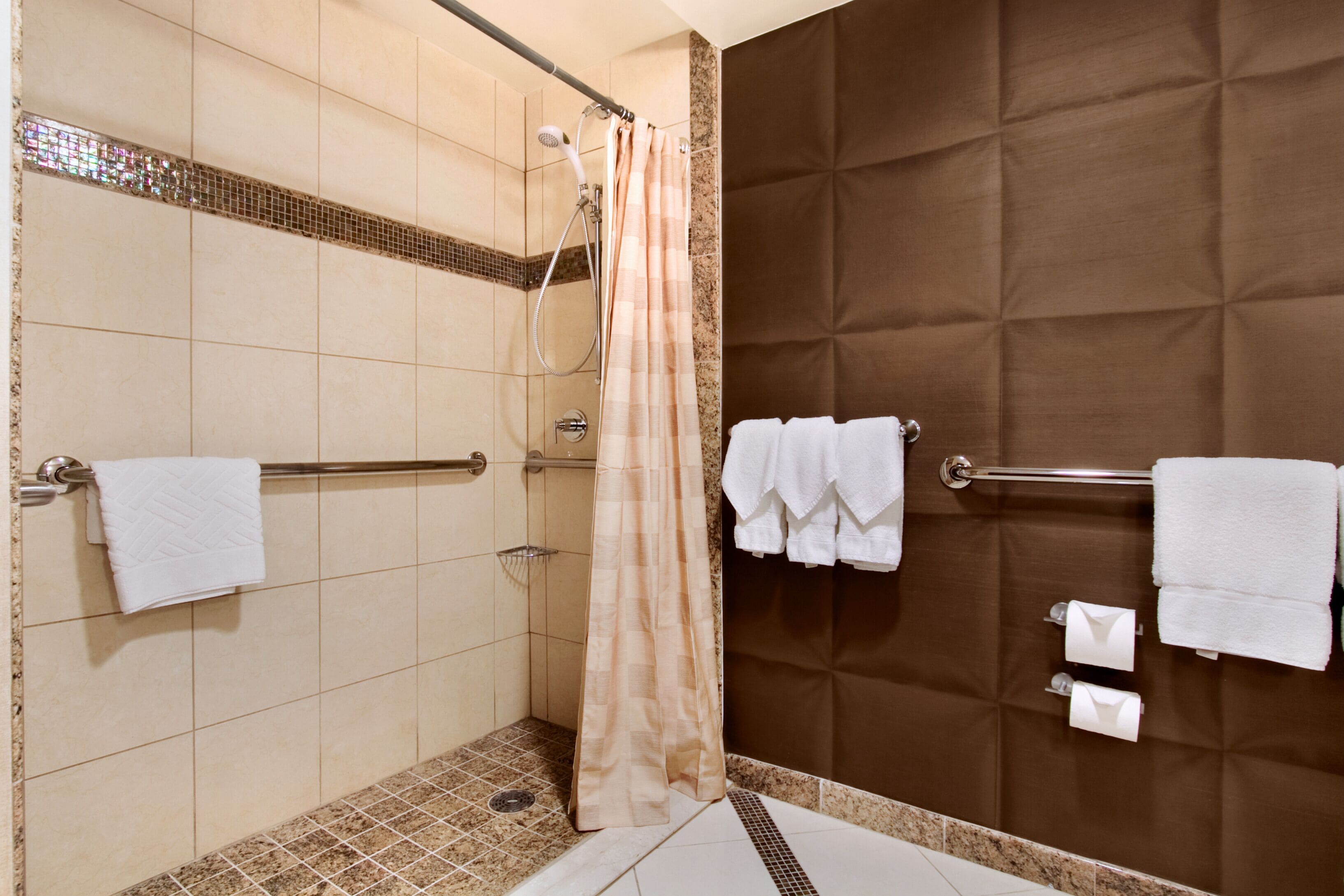 Combined shower/bathtub, designer toiletries, hair dryer, towels