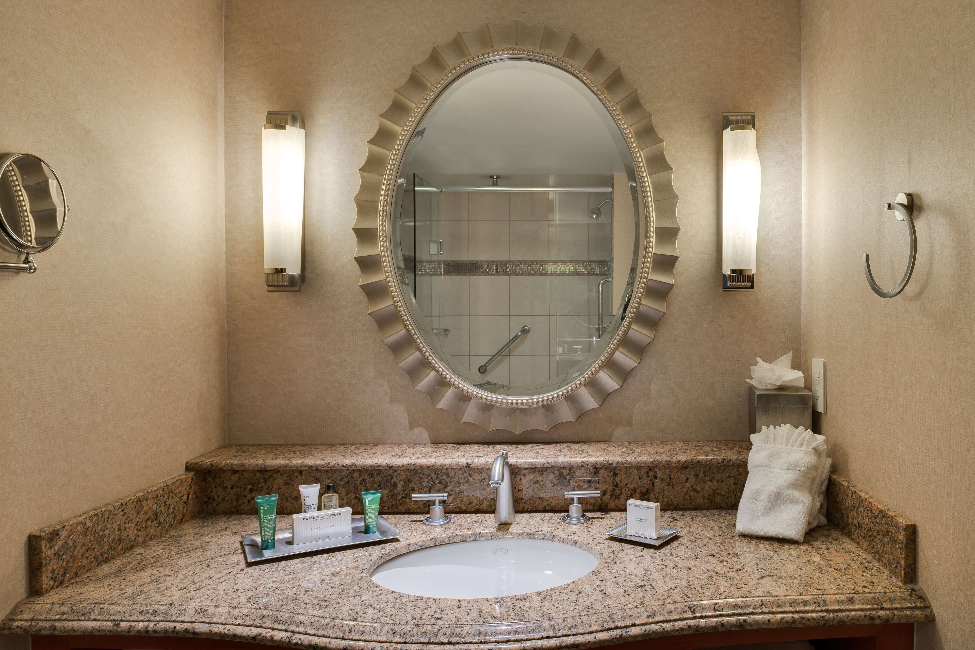 combined shower/bathtub, designer toiletries, hair dryer, towels