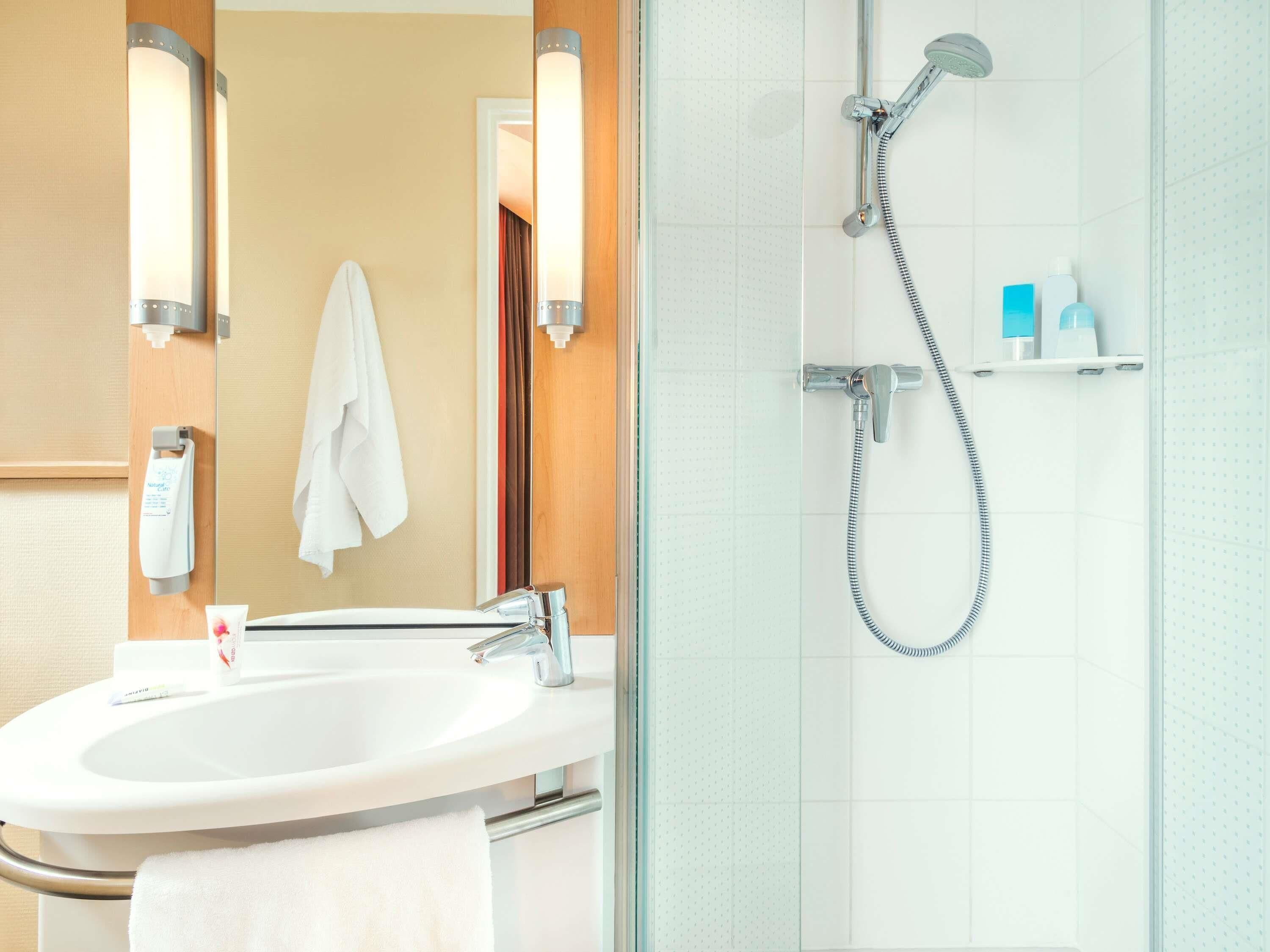 Shower, eco-friendly toiletries, hair dryer, towels