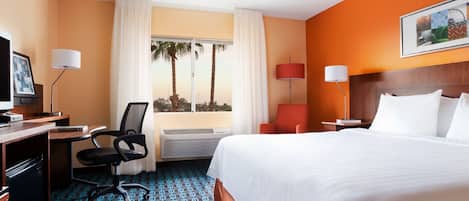 Premium bedding, desk, laptop workspace, blackout drapes