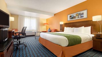 Premium bedding, desk, laptop workspace, blackout curtains