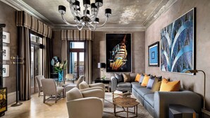 A modern living room with a sofa, armchairs, a coffee table, and a chandelier. - The Gritti Palace, a Luxury Collection Hotel, Venice (Venice)