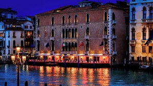 A historic building with arched windows and a balcony, located by a canal with boats. - The Gritti Palace, a Luxury Collection Hotel, Venice (Venice)