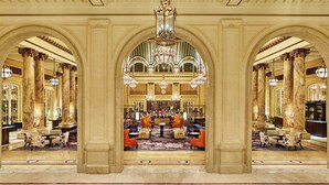 A grand lobby with marble columns, a chandelier, and seating areas. - Palace Hotel, a Luxury Collection Hotel, San Francisco (San Francisco)