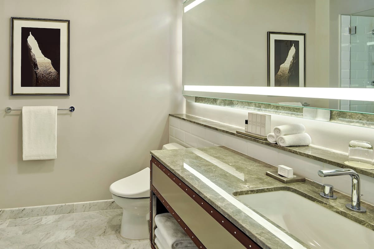 Designer toiletries, hair dryer, bathrobes, slippers
