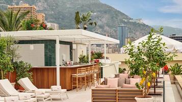 Outdoor pool, open 8:00 AM to 5:00 PM, pool umbrellas, pool loungers