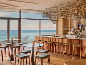4 bars/lounges, poolside bar