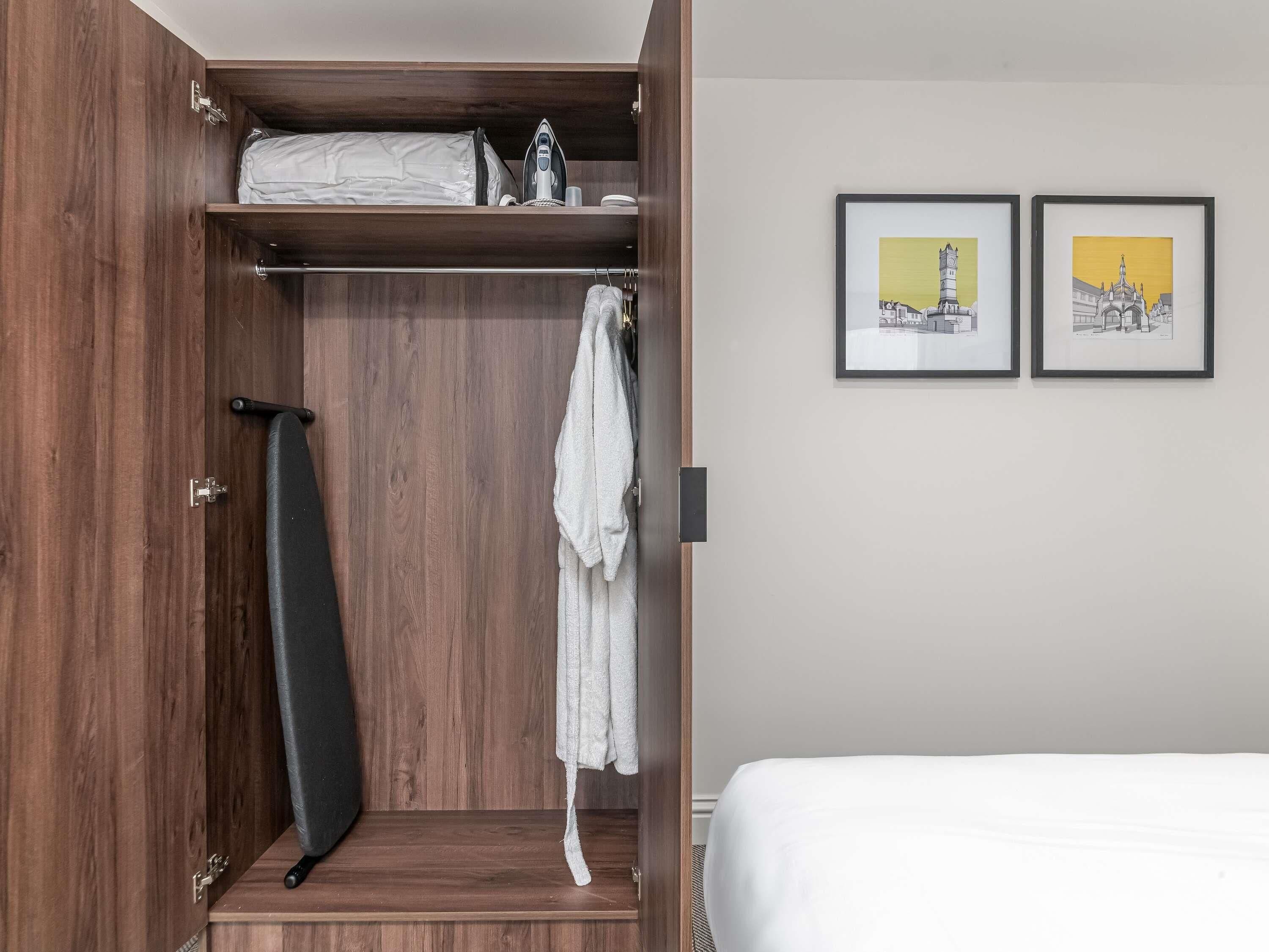 Premium bedding, desk, laptop workspace, blackout drapes