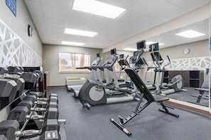 A gym with various exercise equipment including treadmills, elliptical machines, and free weights. - Sleep Inn & Suites Pensacola - University Area (Pensacola)