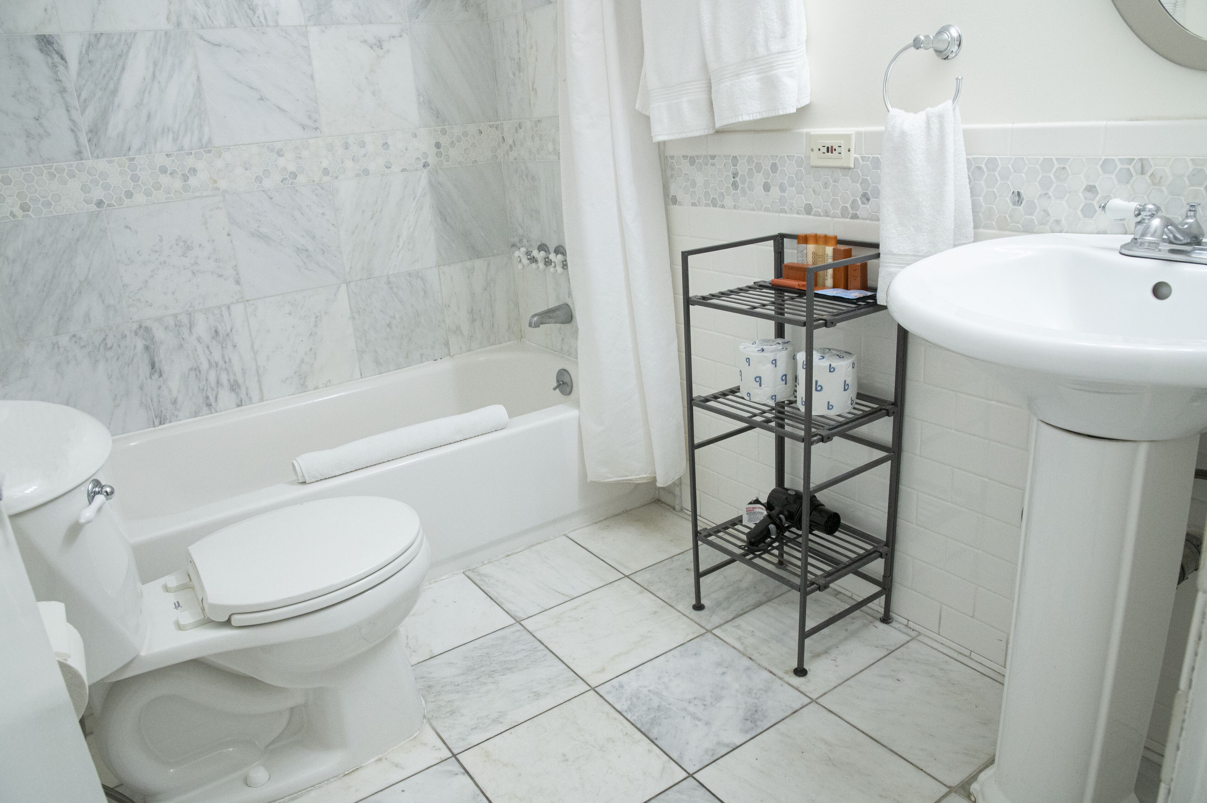 combined shower/bathtub, designer toiletries, hair dryer, bathrobes