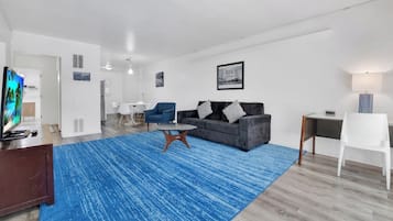 Suite, 2 Bedrooms | Living area | 45-inch TV with cable channels, DVD player