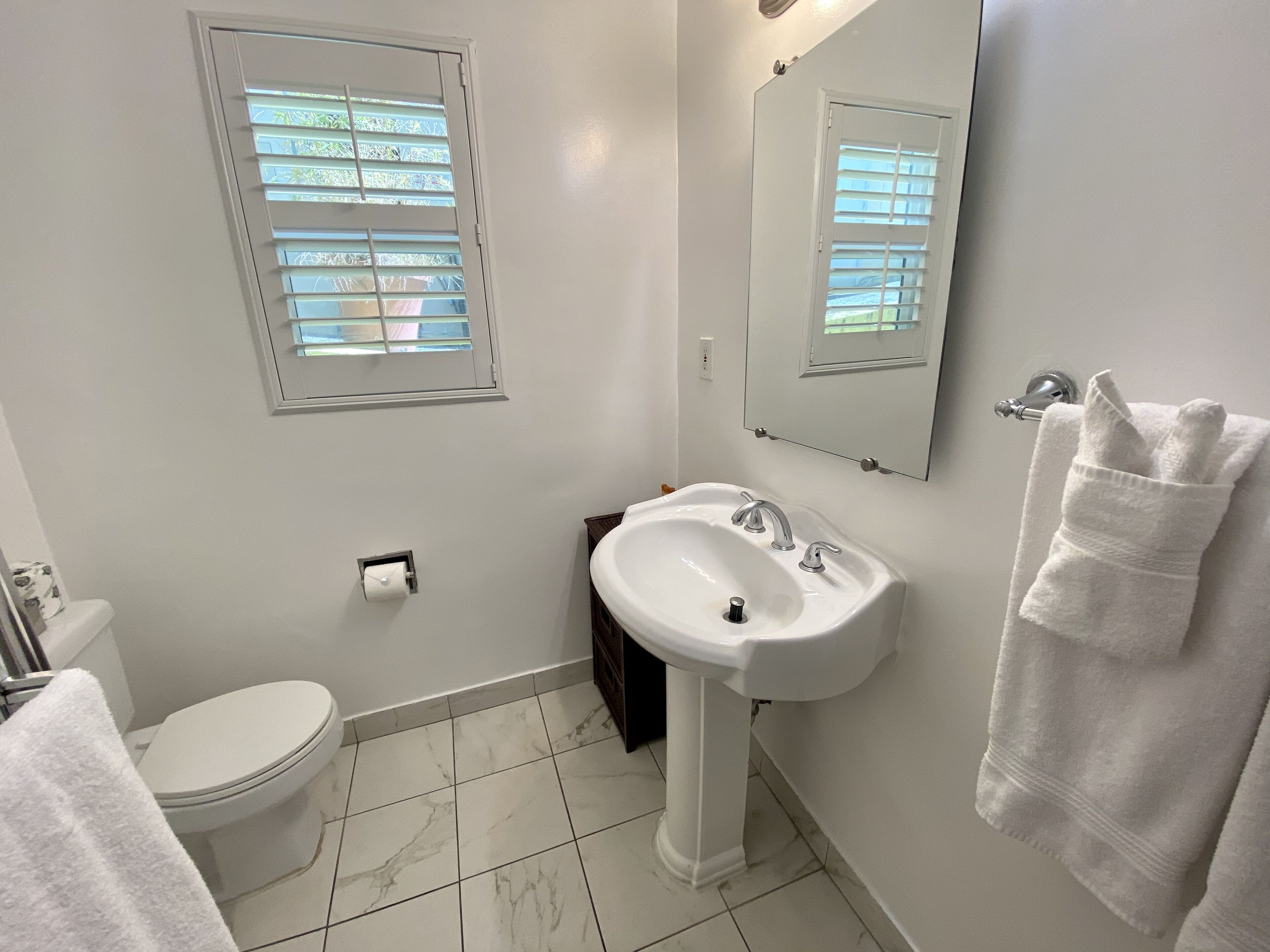 combined shower/bathtub, designer toiletries, hair dryer, bathrobes