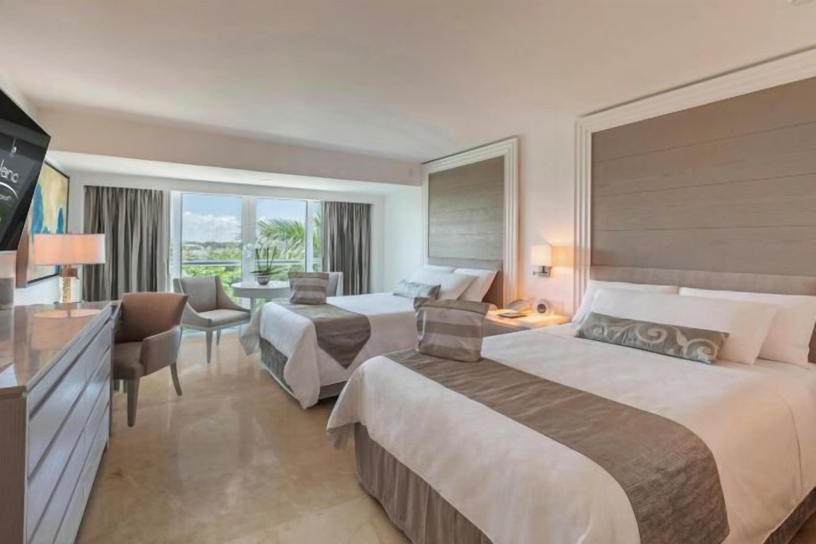 Premium bedding, down comforters, Tempur-Pedic beds, free minibar