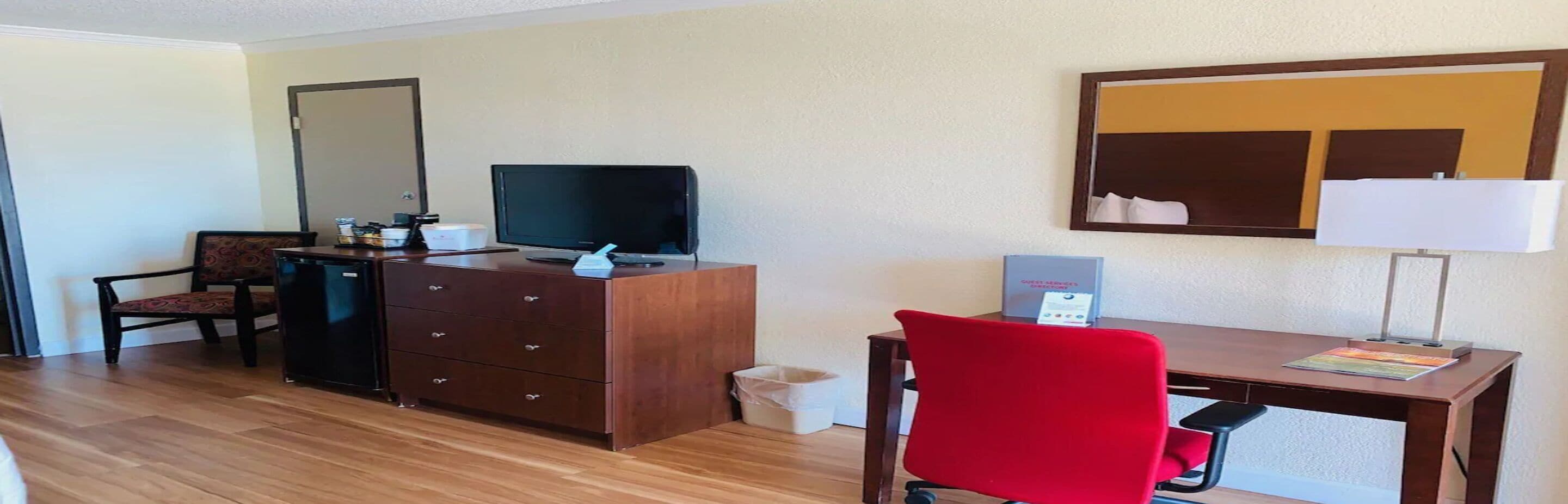 desk, blackout curtains, iron/ironing board, free cots/infant beds