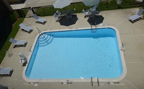 Seasonal outdoor pool, open 9:00 AM to 10:00 PM, pool loungers