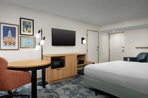 Premium bedding, desk, laptop workspace, blackout drapes