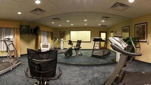 A fitness room with treadmills, elliptical machines, and a stationary bike. - Holiday Inn Express Hotel & Suites Lake Okeechobee by IHG (Okeechobee)