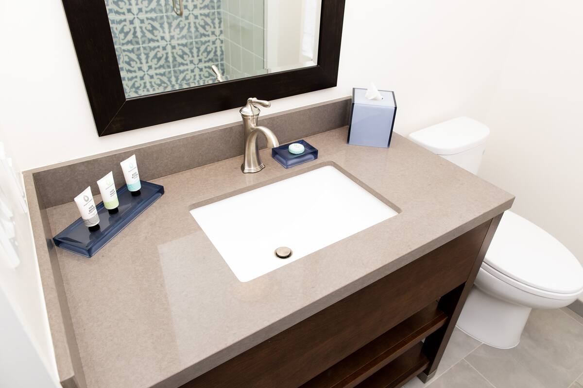 standard room, 1 king bed | bathroom | designer toiletries, towels