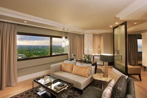Sandton Sun Junior Suite Double Room | Minibar, in-room safe, desk, laptop workspace