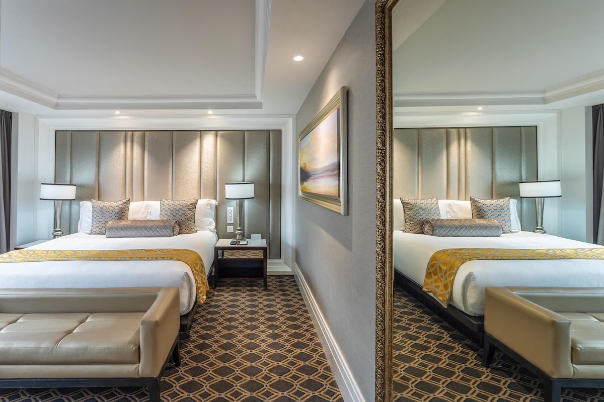 Sandton Sun Junior Suite Double Room | Minibar, in-room safe, desk, laptop workspace