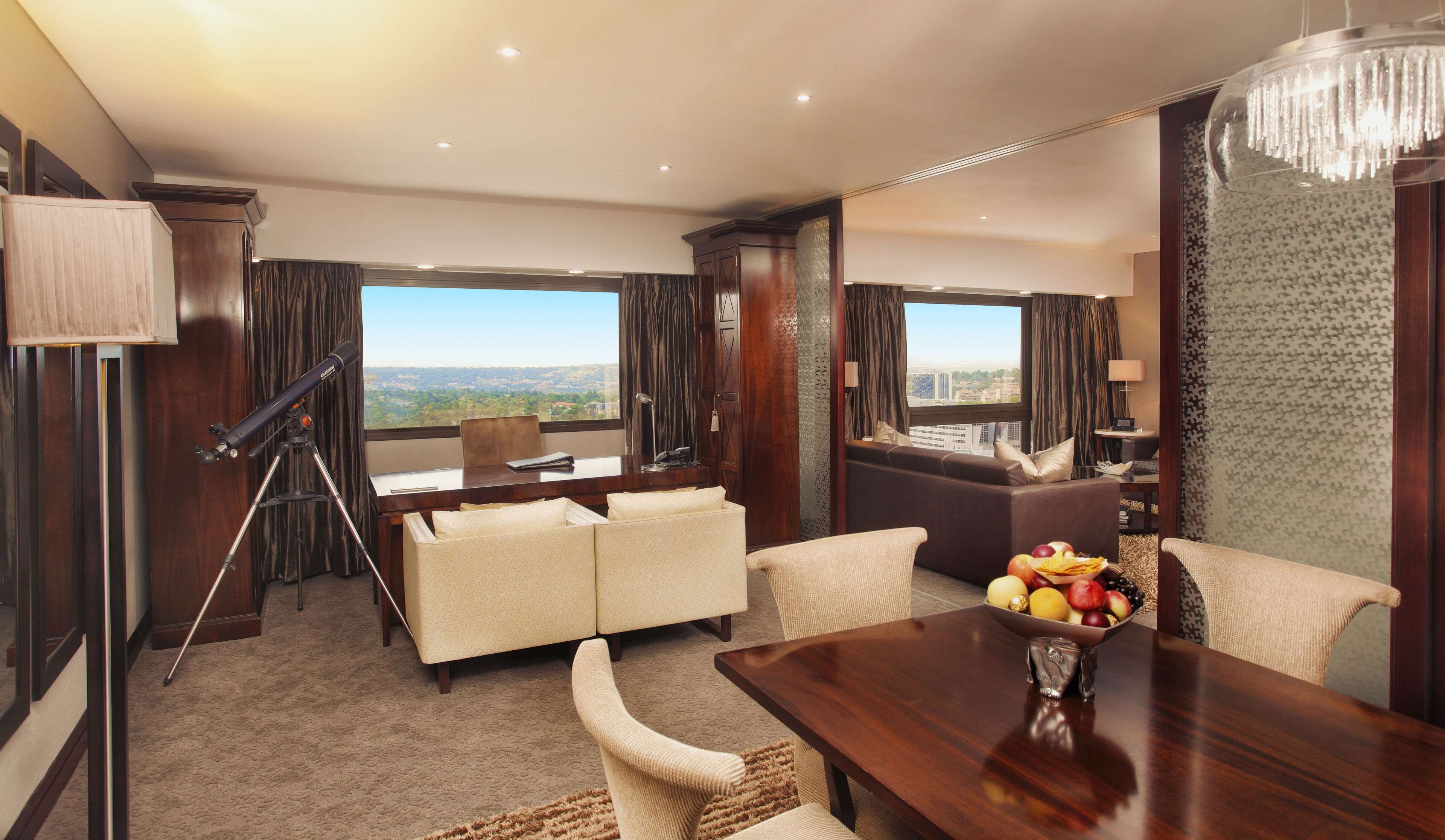 Sandton Sun Presidential Suite | Minibar, in-room safe, desk, laptop workspace