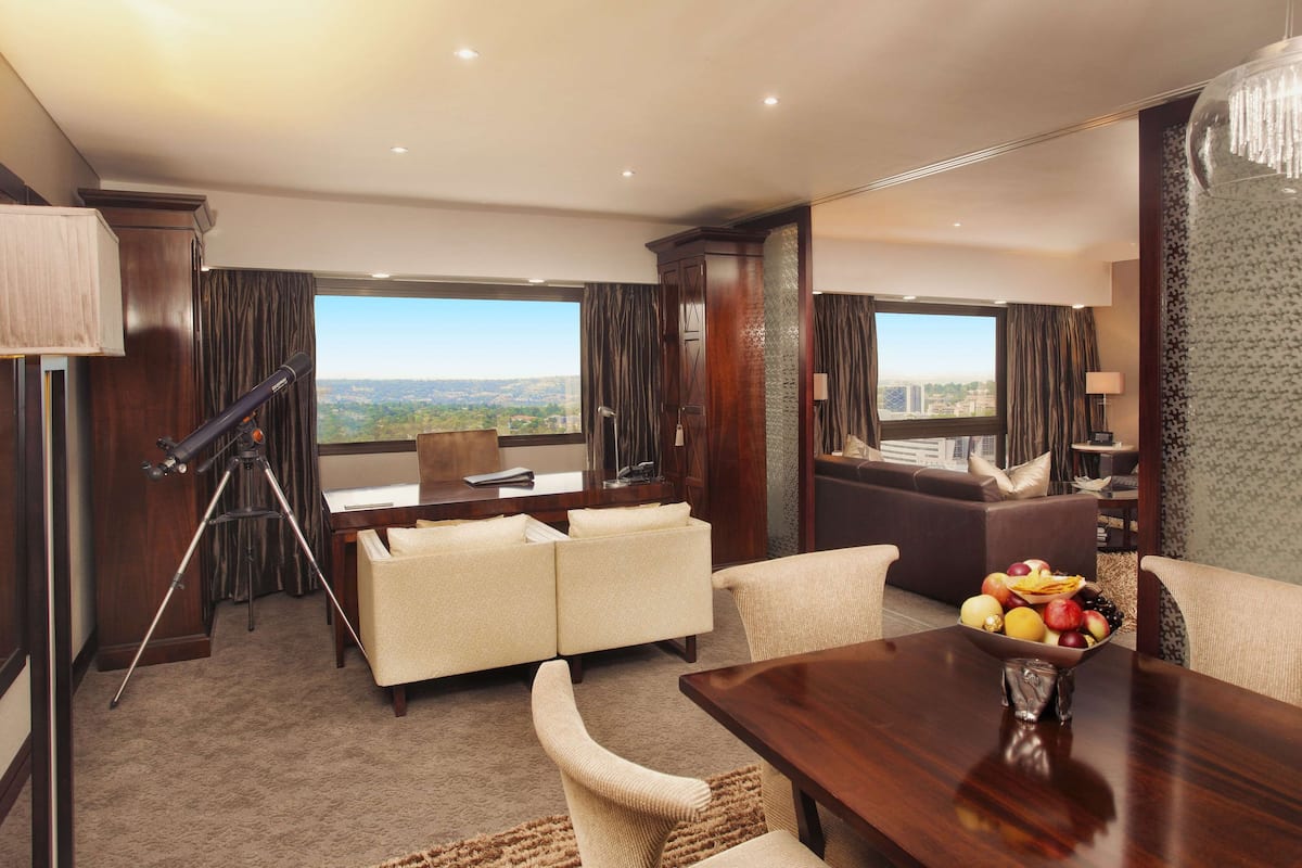 Sandton Sun Presidential Suite | Minibar, in-room safe, desk, laptop workspace
