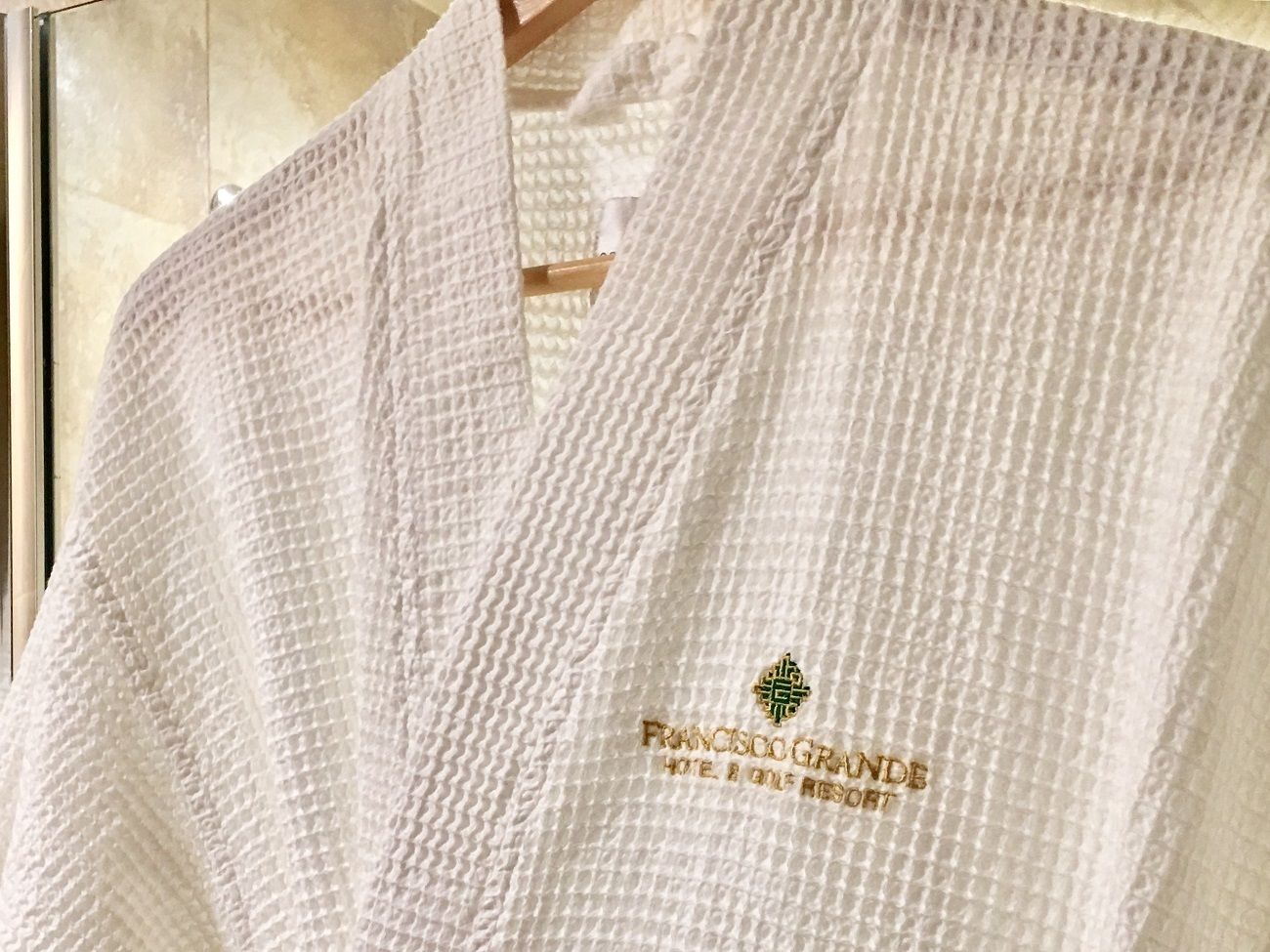 designer toiletries, hair dryer, towels