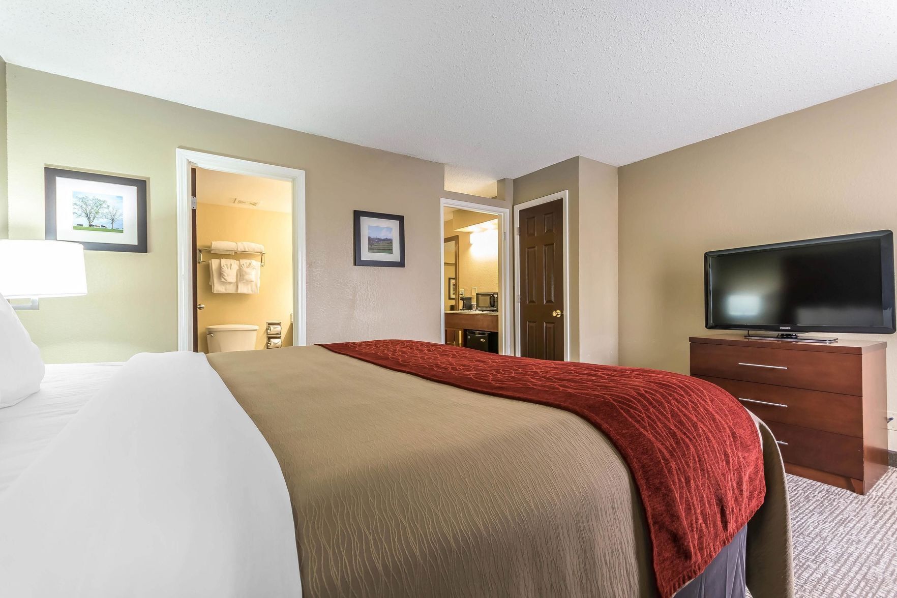 Premium bedding, desk, laptop workspace, iron/ironing board