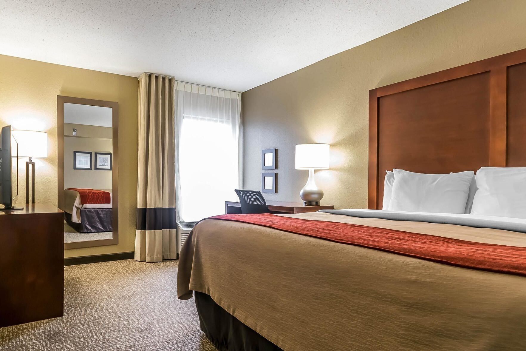 Premium bedding, desk, laptop workspace, iron/ironing board