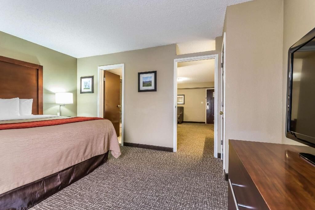 Premium bedding, desk, laptop workspace, iron/ironing board