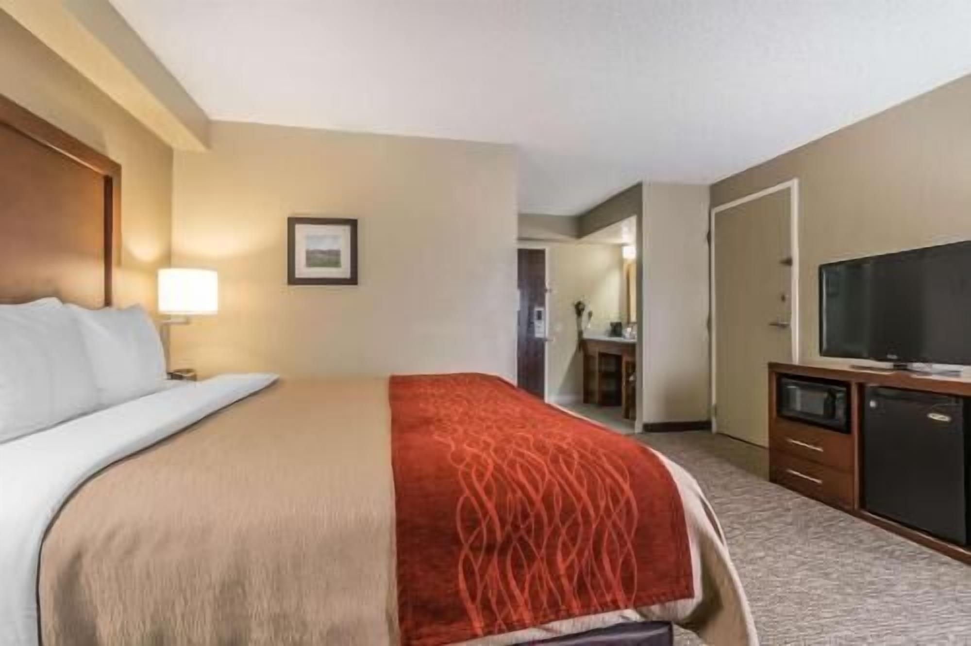 Premium bedding, desk, laptop workspace, iron/ironing board