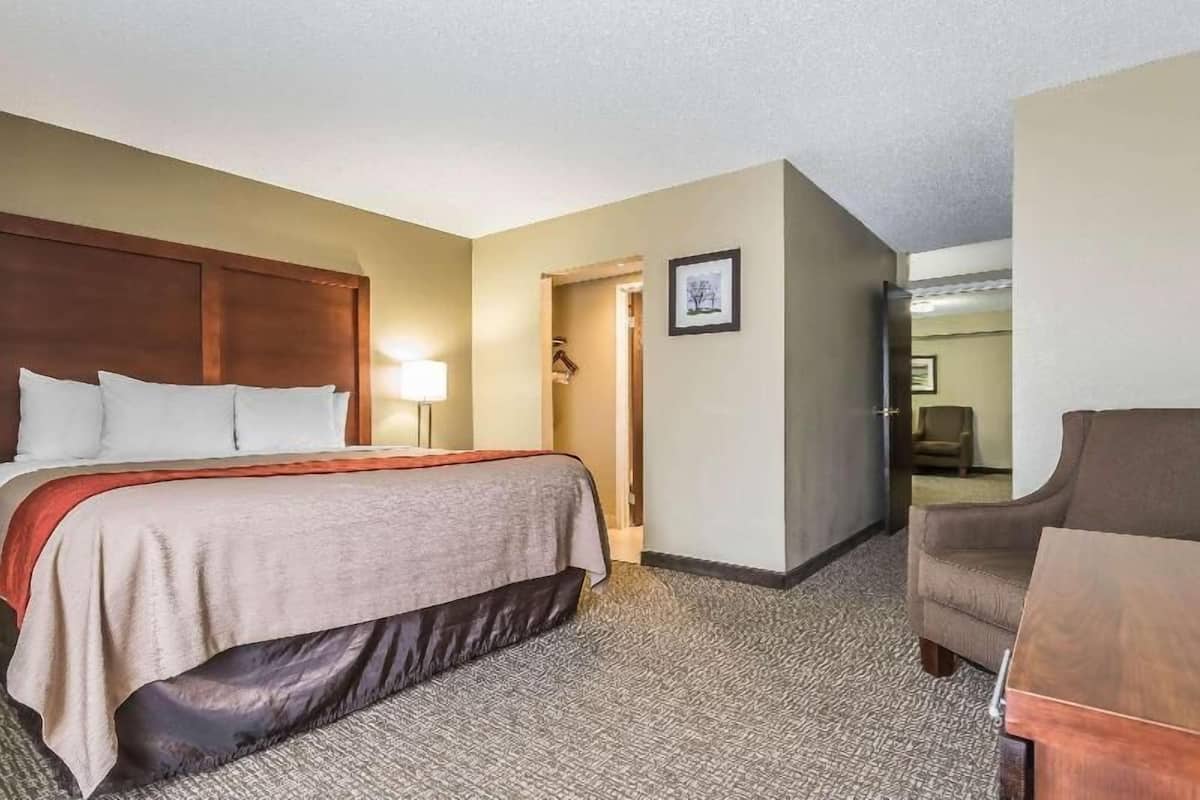 Premium bedding, desk, laptop workspace, iron/ironing board